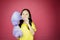 Portrait of adorable girl eating a cotton candy