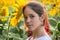 Portrait of adorable girl on sunflower field