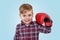 Portrait of an adorable little boy wearing boxing gloves