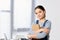 portrait of adorable preteen child standing with books