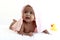 Portrait of adorable six month crawling African American baby covered in towel after bath time, happy smiling sweet little girl