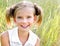 Portrait of adorable smiling little girl child in dress outdoor