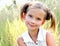 Portrait of adorable smiling little girl child in dress outdoor