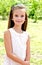 Portrait of adorable smiling little girl child outdoors