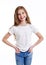 Portrait of adorable smiling little girl child preteen in jeans and white t-shirt isolated