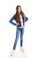 Portrait of adorable smiling little girl child preteen standing in jeans isolated