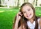 Portrait of adorable smiling little girl child schoolgirl teenager outdoors