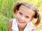 Portrait of adorable smiling little girl in summer day