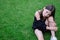 portrait of adorable teen brunette girl in black clothes outside. charming ukrainian child enjoying summer holidays