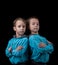 Portrait of adorable twin boys on black