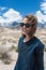 Portrait of Adult female wearing sunglasses on a windy summer day in the Alabama Hills in Lone Pine California, in the Eastern