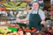 Portrait of adult man seller in supermarket