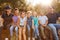 Portrait Of Adult Team Leaders With Group Of Children At Outdoor Activity Camp