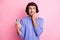 Portrait of afraid guy hold telephone bite nails look empty space wear purple sweater isolated on pastel pink color