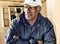 Portrait of african american Baseball Coach Standing in Dugout