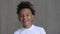 Portrait of African American boy is smiling and laughing in front of camera at home interior spbi.