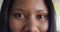 Portrait of african american businesswoman looking at camera and smiling at office, slow motion