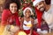 Portrait of African American family in front of Christmas tree