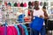 Portrait of African American man choosing shorts in sporting goo