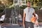 Portrait african american man standing with a basket ball on the court. Handsome male basketball player holding a sports