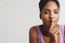 Portrait of african american nice woman making silence gesture
