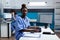 Portrait of african american pharmacist nurse typing medical prescription