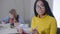 Portrait of African American student in eyeglasses looking at camera and smiling. Intelligent girl doing homework with