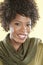 Portrait of an African American woman smiling with a stole round her neck over colored background