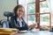 Portrait of an African Americans female lawyer using a notebook to keep track of her work schedule.