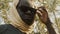 Portrait of african black man with head covering and sunglasses in park