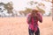 Portrait of african photographer covering his face with the camera