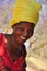 Portrait african women laughing with yellow turban