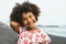 Portrait of Afro American child having fun on the beach during vacation