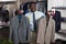 Portrait of afro-american man buyer choosing business style jacket in the shop