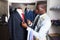 Portrait of afro-american man customer choosing business style tie in the shop