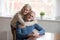 Portrait of aged happy wife hugging husband from behind