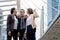 Portrait of Aggressive young Asian women in formal wear or businesswoman fighting while man dissuade for fight