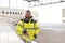 Portrait of an aircraft mechanic in a hangar with jets at the ai