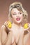 Portrait of Alluring Caucasian Blond Girl With Two Lemons