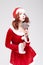 Portrait of Alluring Caucasian Red haired Santa Helper with Color Sweet Lollipop Sugar-Plum Candy