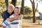 Portrait of American senior beautiful and happy mature couple around 70 years old showing love and affection smiling together in t