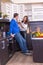 Portrait Of Amorous Couple With food In The Kitchen