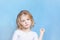 Portrait of Angel Like Blond Girl in Light Studio