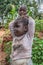 Portrait of an Angolan child, with very expressive face, with her brother on background