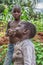 Portrait of an Angolan child, with very expressive face, with her brother on background