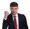 Portrait of angry businessman shaking his fist in the air