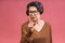 Portrait of angry grey haired old strict senior woman wearing glasses pointing up threatening with finger. Grandmother isolated