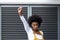 Portrait of angry mixed race woman raising fist