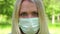 Portrait of an angry woman in a medical mask. Annoyed girl in medical mask on quarantine