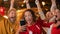 Portrait of an Anxious Multiethnic Female in Red Jersey Holding a Smartphone, Nervous About the